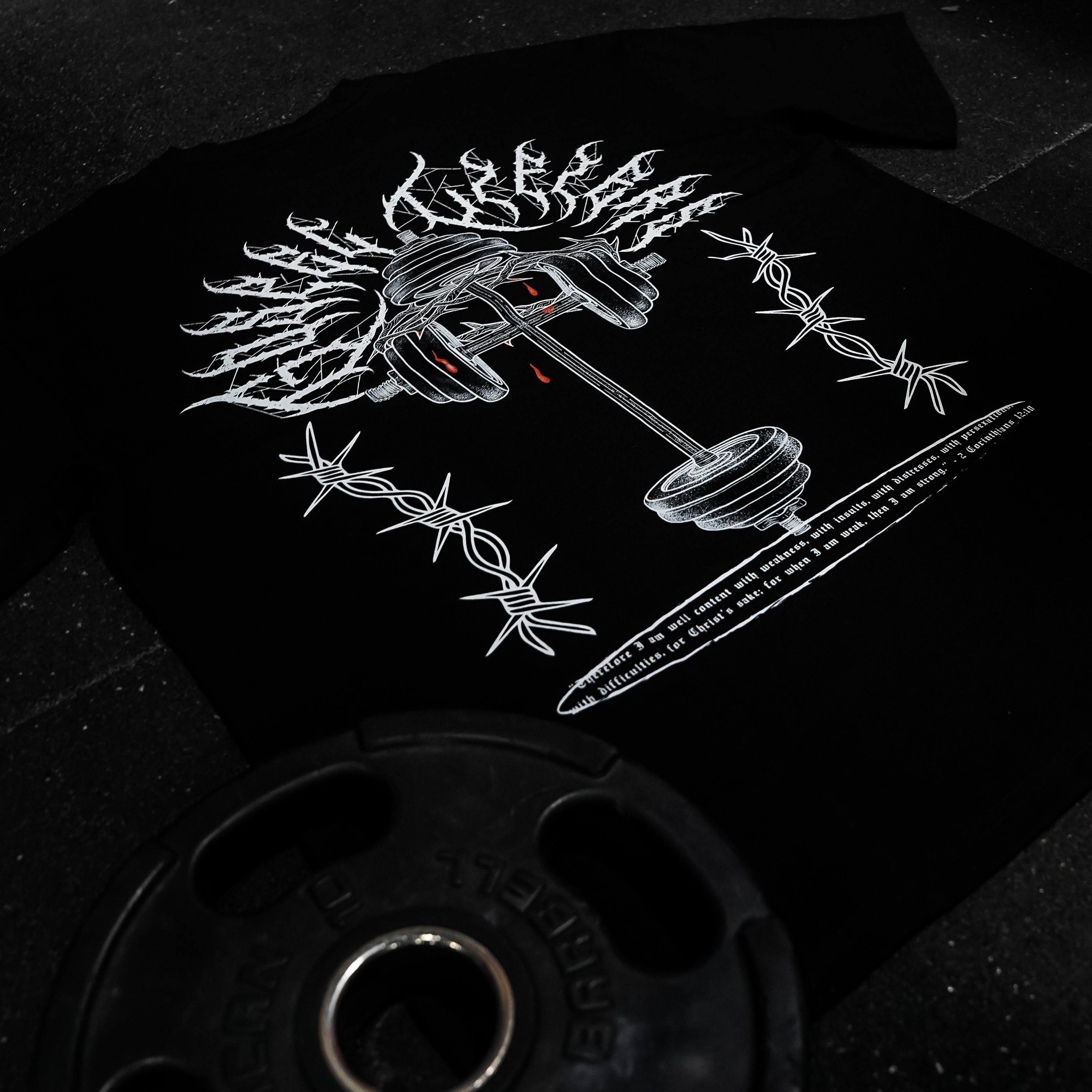 Black t-shirt with white graphic design on a dark background